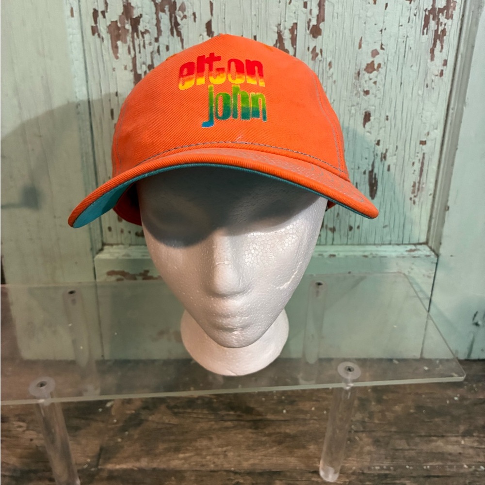 Orange Elton John snap back hat